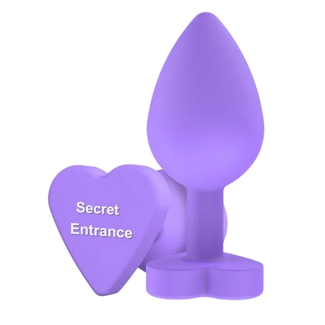 Plug anal TOYJOY Anal Play Booty Sweethearts. cu mesaj „Secret Entrance pe baza în formă de inimă. diametru 3.5 cm. mov